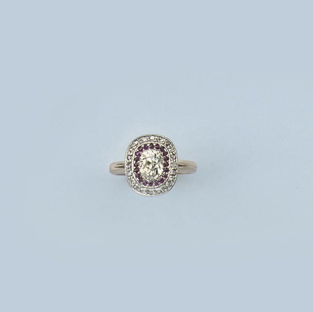 A PAIR OF DIAMOND EARCLIPS AND A RUBY AND DIAMOND RING