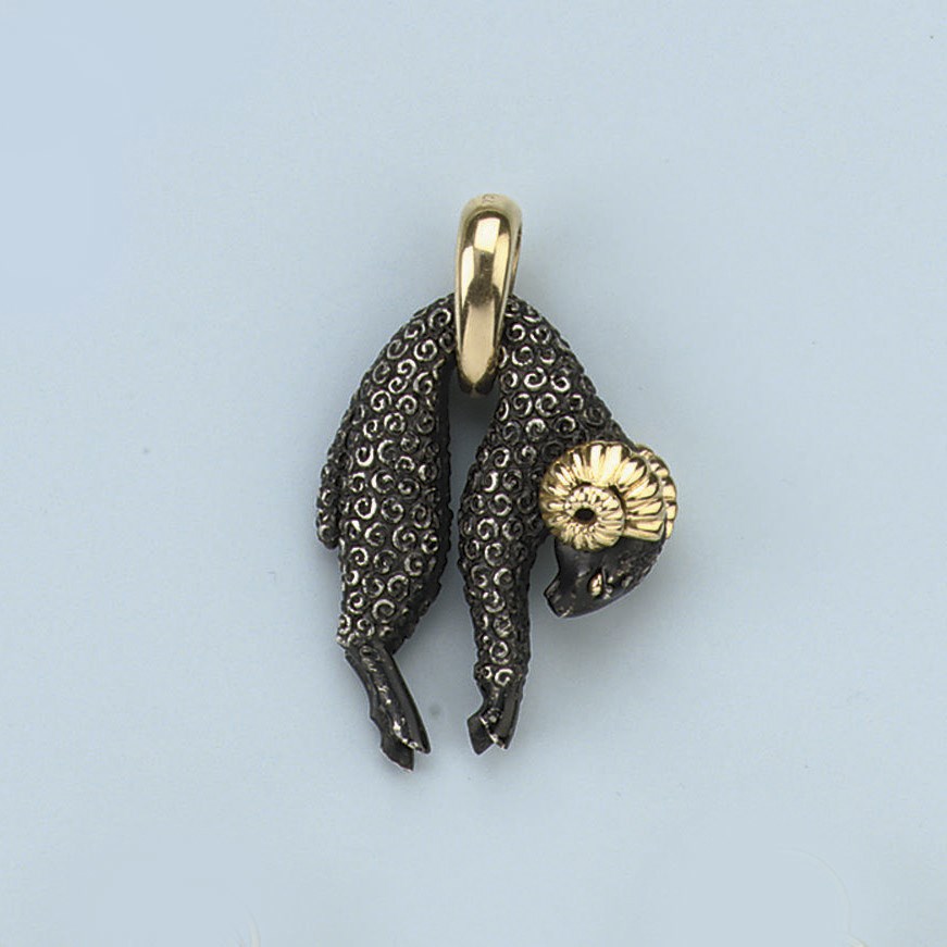 A GOLD "TOISON D'OR" PENDANT, BY CARTIER