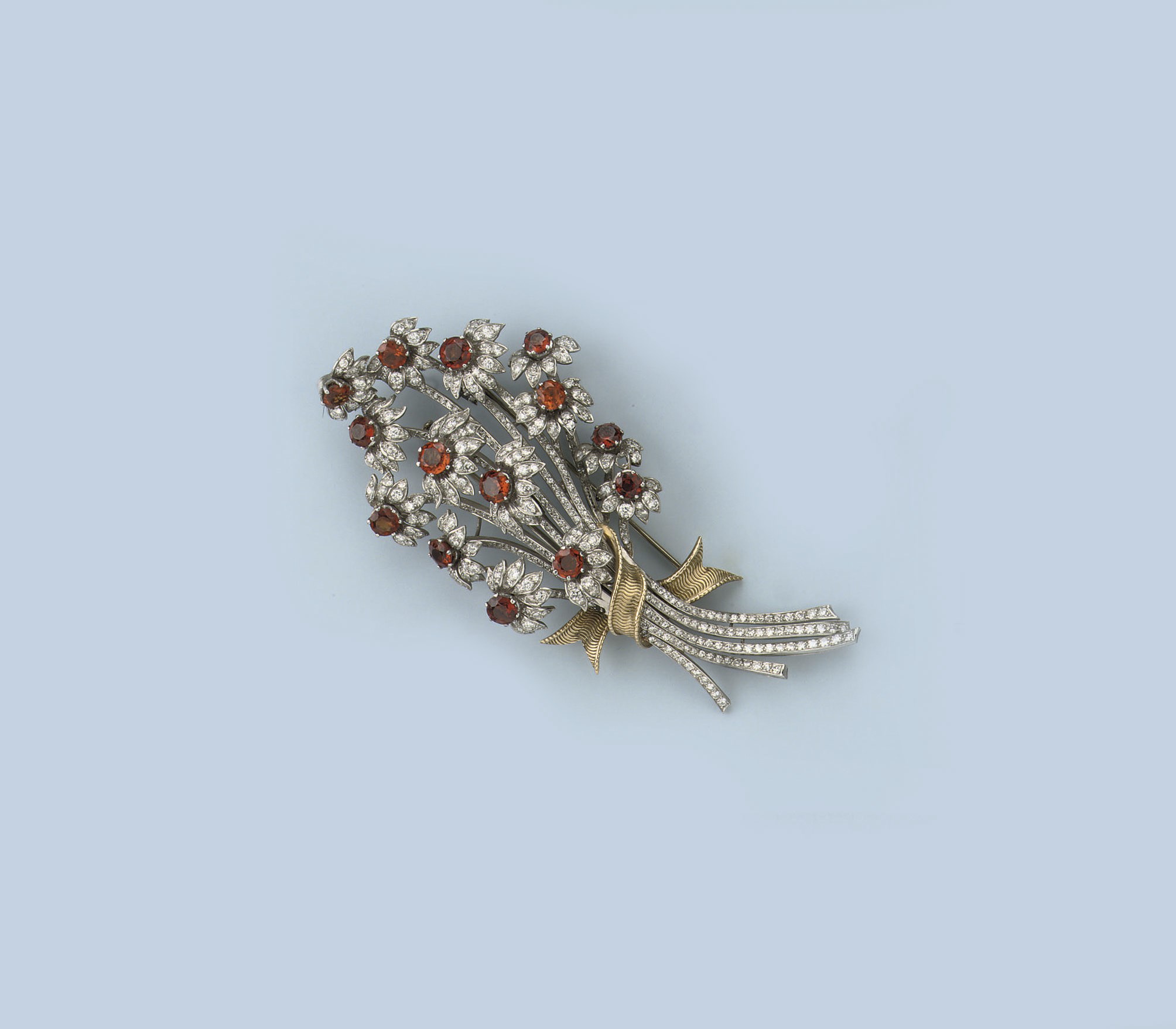 A CITRINE AND DIAMOND FLOWER BROOCH