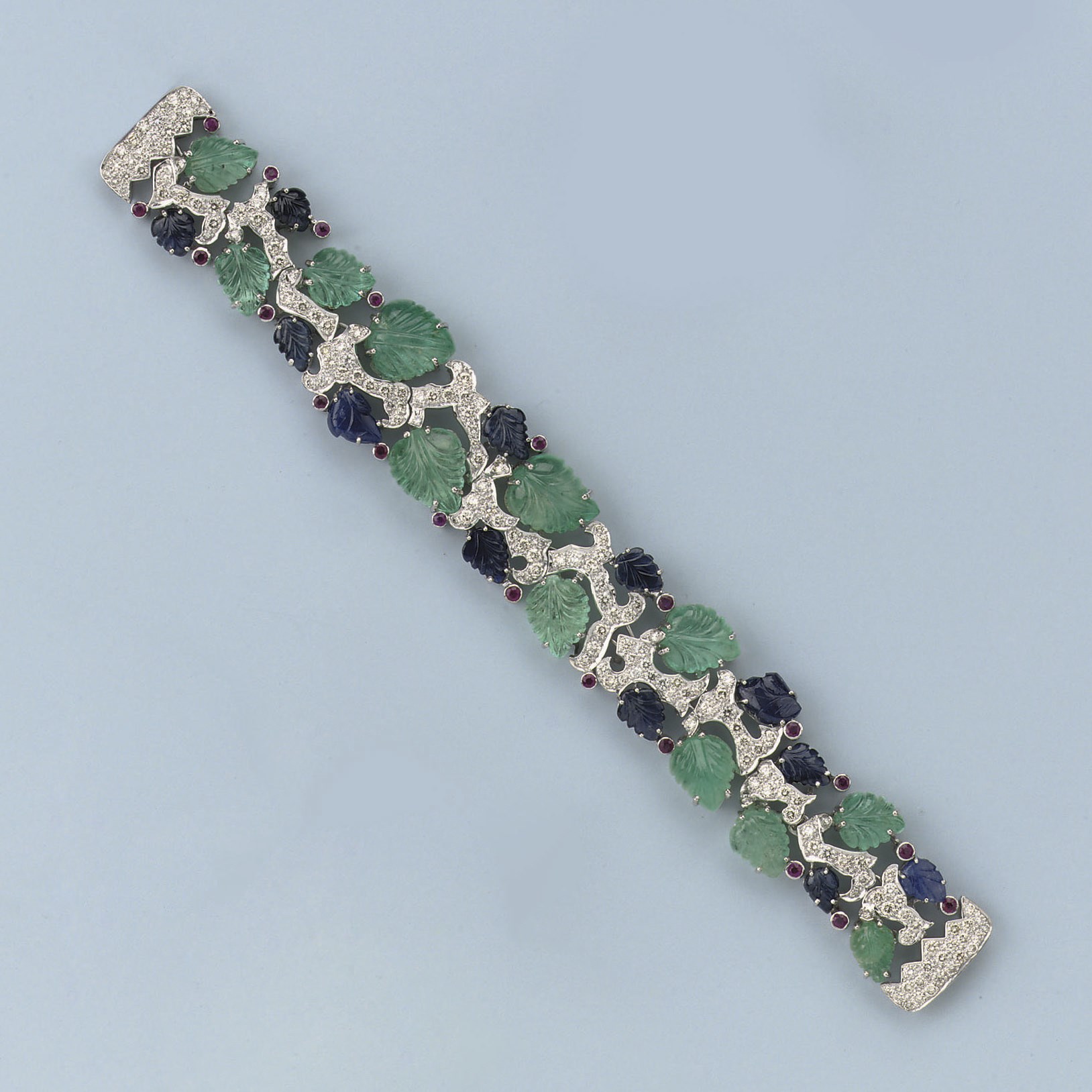 A CARVED GEM-SET AND DIAMOND BRACELET