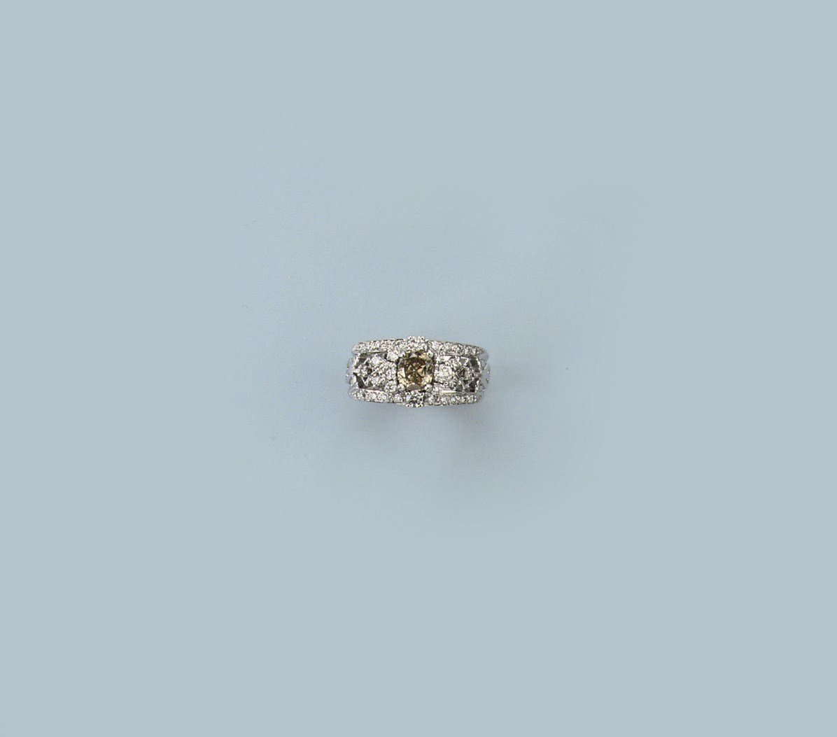 A COLOURED DIAMOND AND DIAMOND DRESS RING