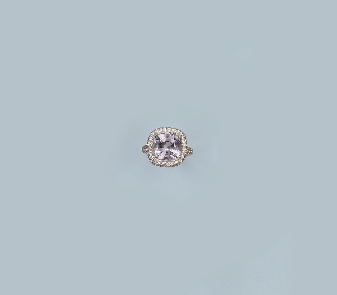 A KUNZITE AND DIAMOND RING