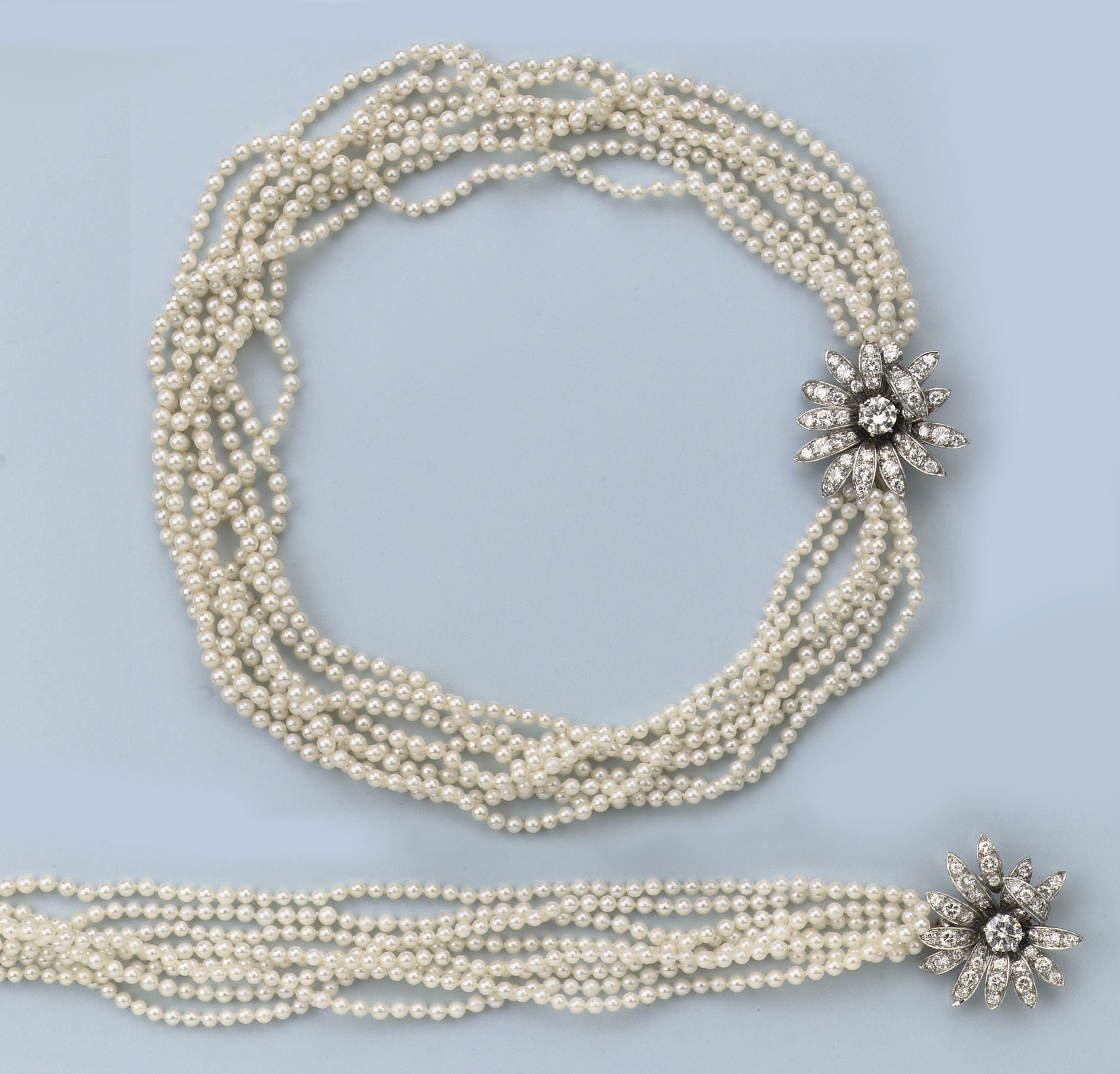 A CULTURED PEARL AND DIAMOND NECKLACE AND BRACELET