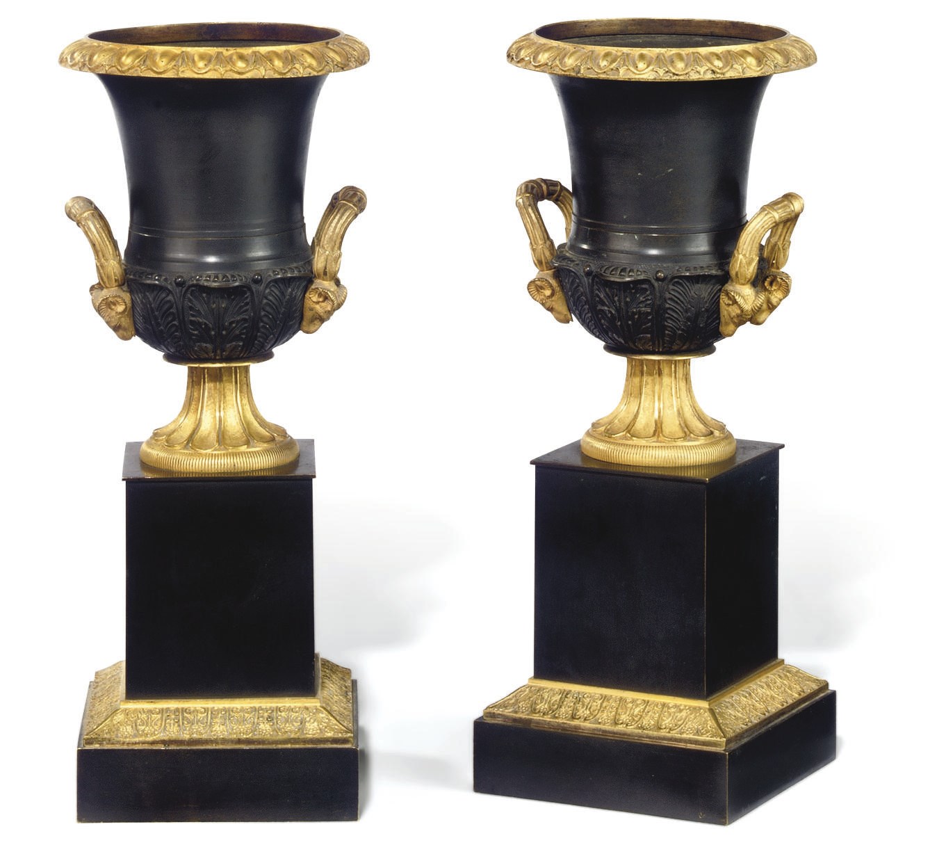 A PAIR OF RESTAURATION GILT AND PATINATED BRONZE URNS