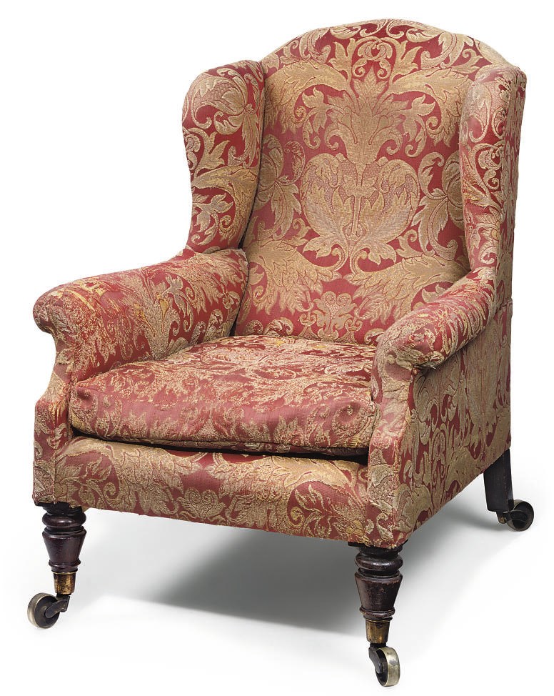 A GEORGE IV GRAINED ROSEWOOD WING ARMCHAIR