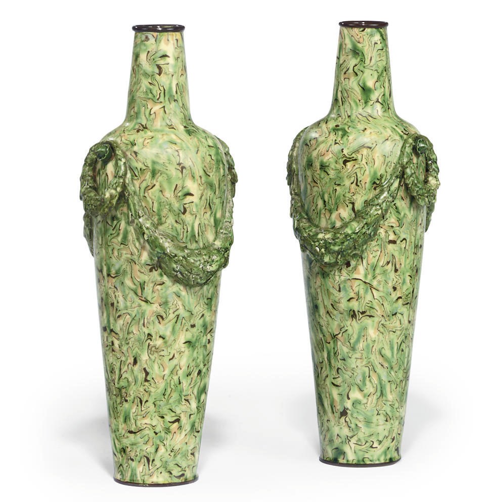 A PAIR OF CONTINENTAL POTTERY MARBLED VASES