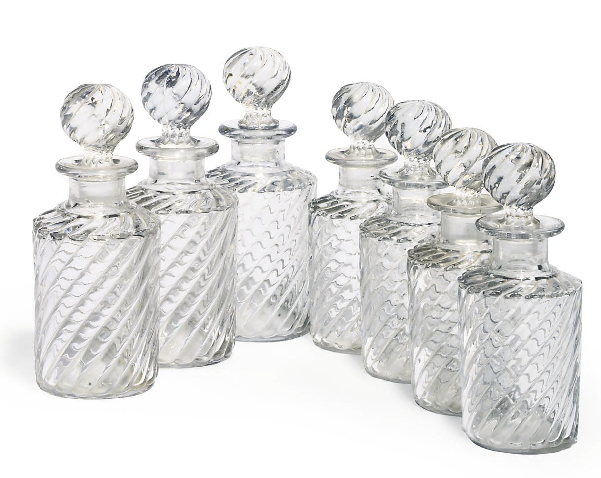 A GRADUATED SET OF VICTORIAN DECANTERS AND STOPPERS
