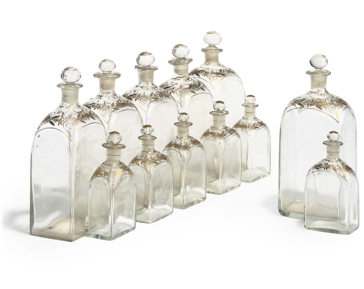 A SET OF CONTINENTAL GLASS TRAVELLING FLASKS
