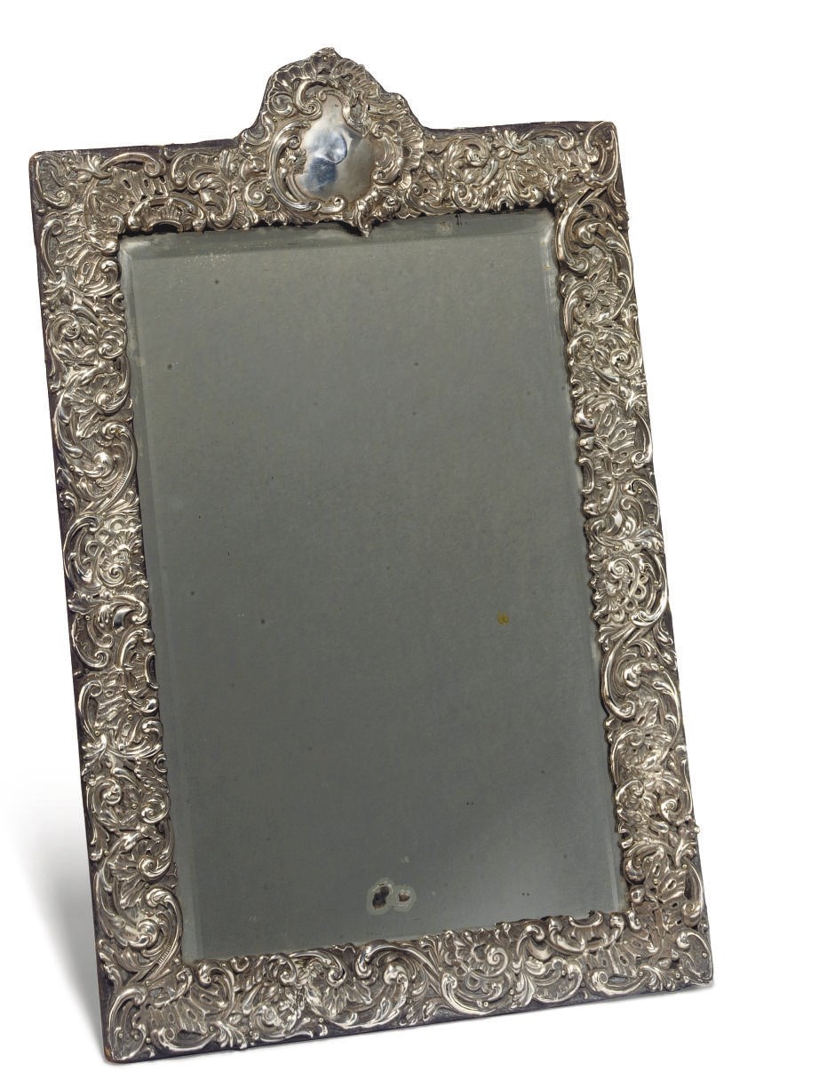 AN EDWARDIAN SILVER TOILET MIRROR