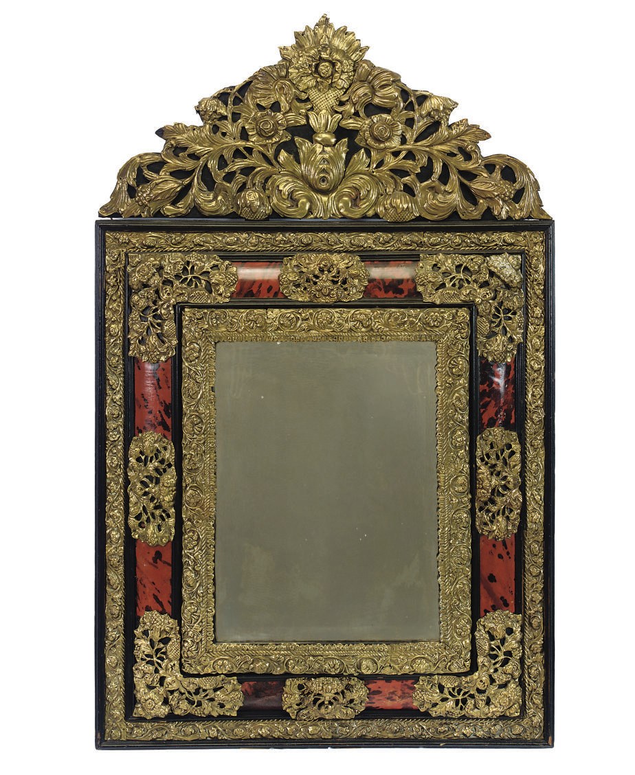 A DUTCH REPOUSSE BRASS AND SIMULATED RED TORTOISESHELL MIRROR