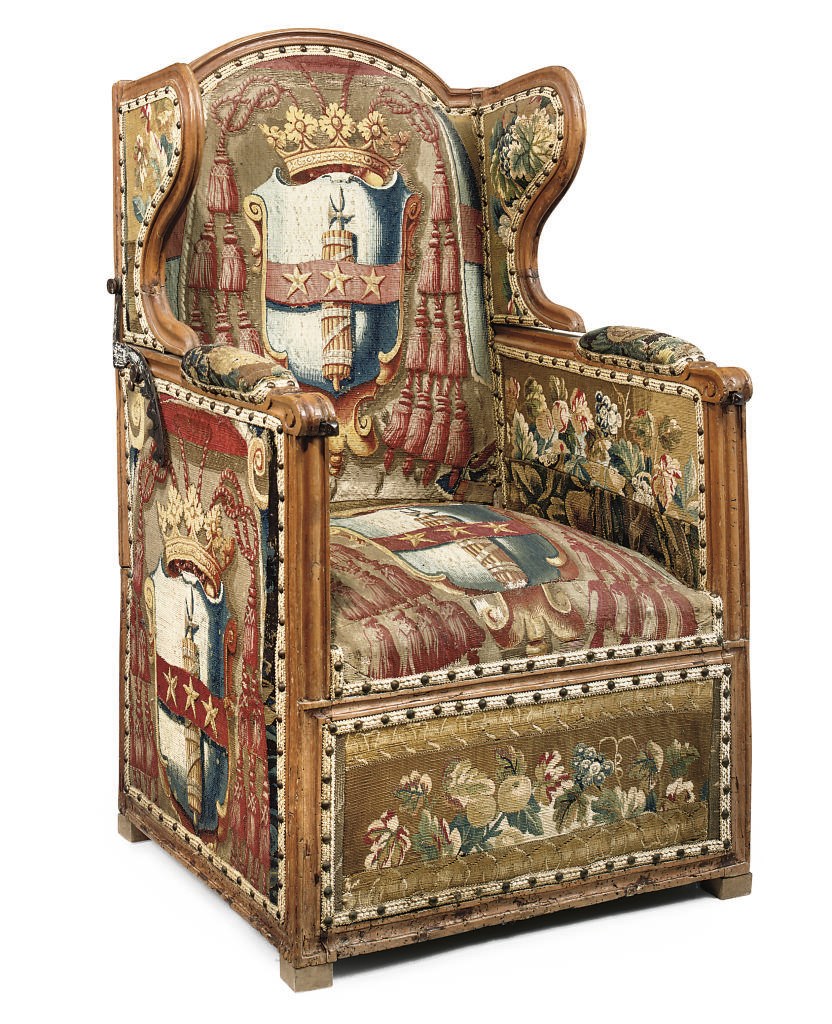 A FRENCH BEECH RECLINING WING ARMCHAIR