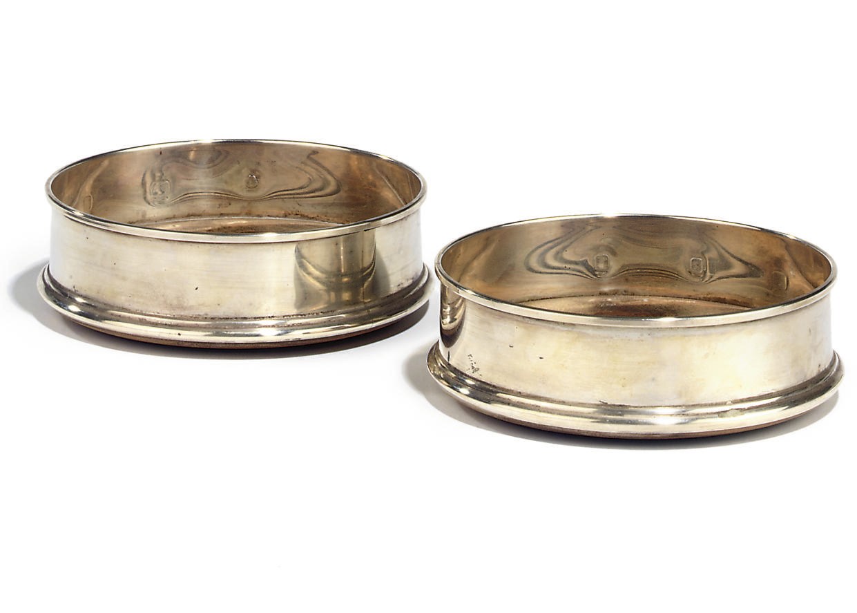 A MODERN PAIR OF SILVER WINE BOTTLE COASTERS