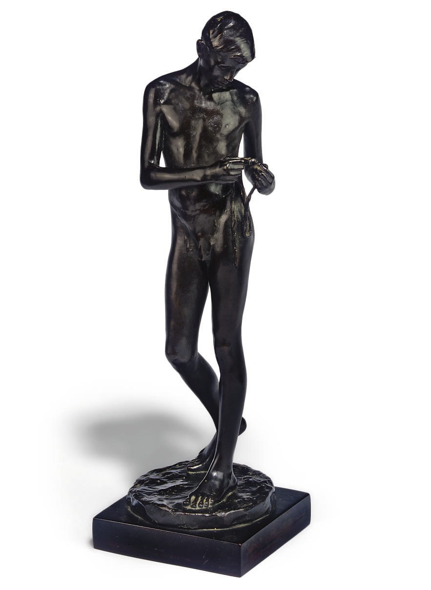 AN ENGLISH BRONZE MODEL OF A BOY