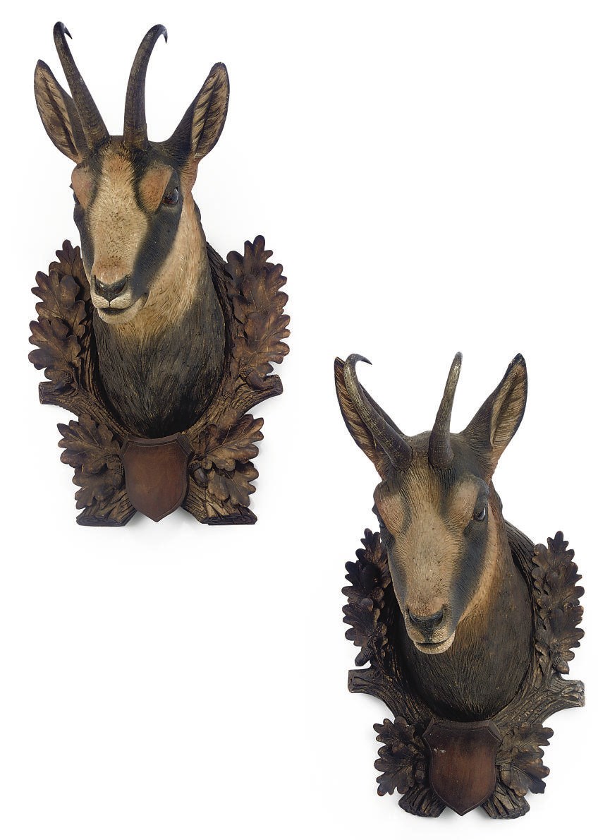 A PAIR OF SWISS 'BLACK FOREST' CARVED AND PAINTED WOOD DEER HEAD TROPHIES