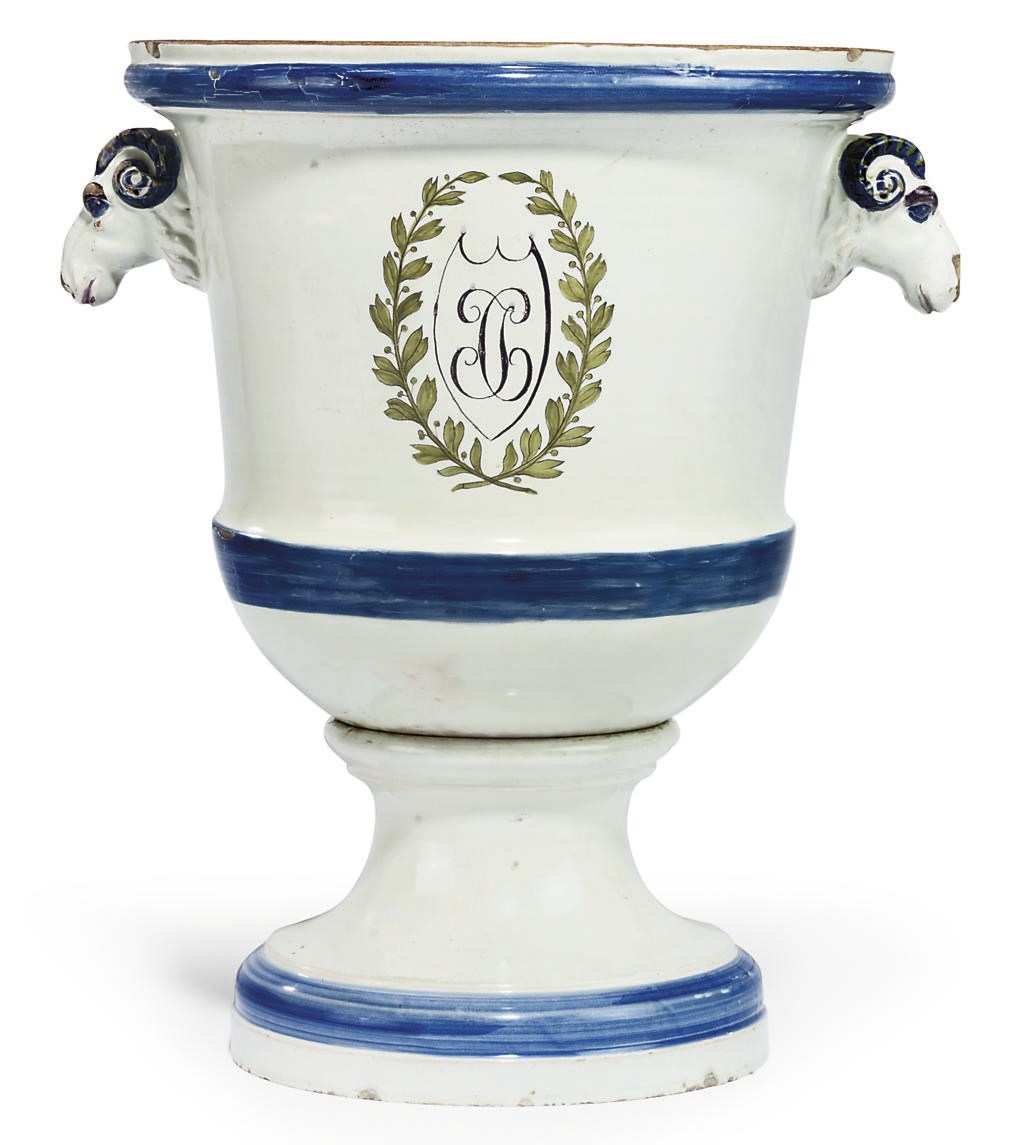 A CONTINENTAL FAIENCE URN