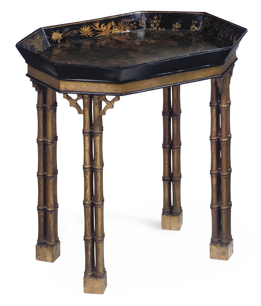 A REGENCY BLACK AND GILT PAPIER-MACHE TRAY ON LATER STAND