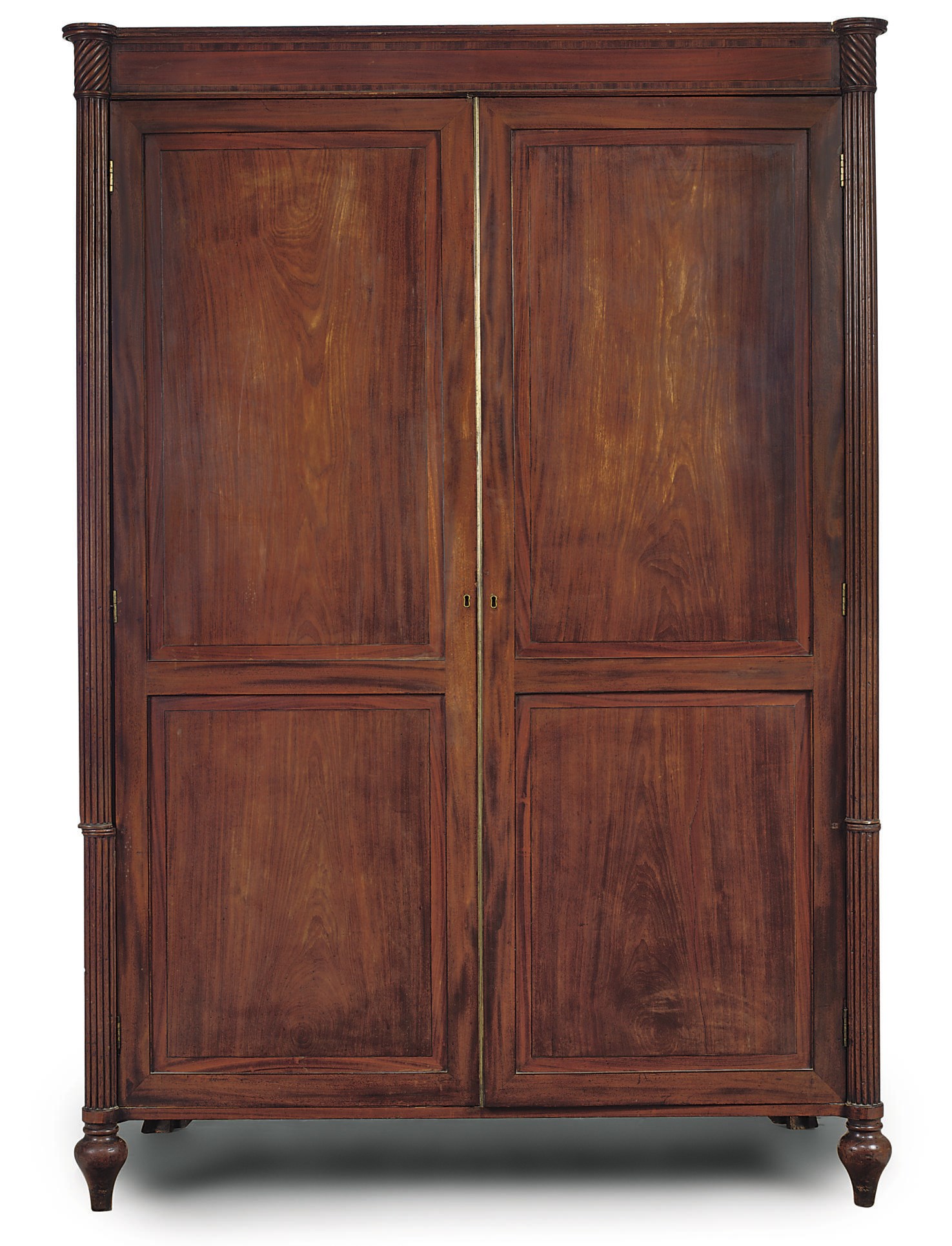 A GEORGE III MAHOGANY AND CROSSBANDED CLOTHES PRESS