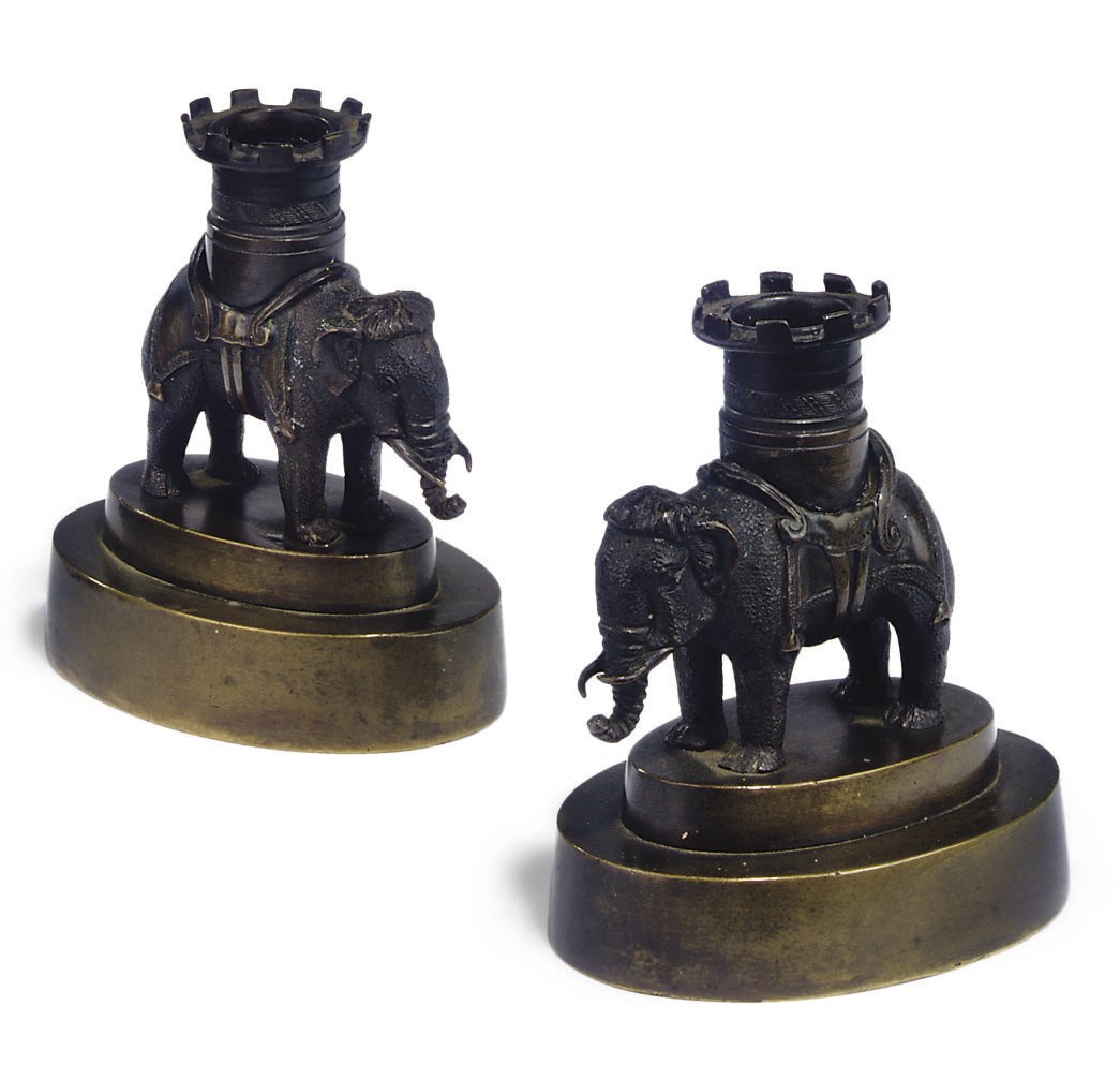A PAIR OF REGENCY BRONZE CANDLESTICKS