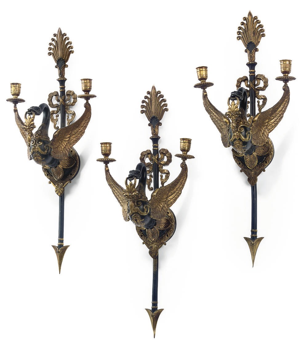 A SET OF THREE FRENCH GILT AND PATINATED BRONZE TWIN-LIGHT WALL APPLIQUES