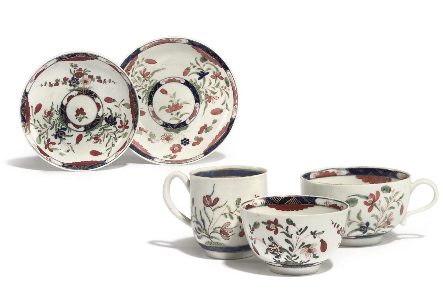 A WORCESTER KEMPTHORNE PATTERN TEABOWL AND SAUCER, A TEACUP AND SAUCER AND A COFFEE-CUP