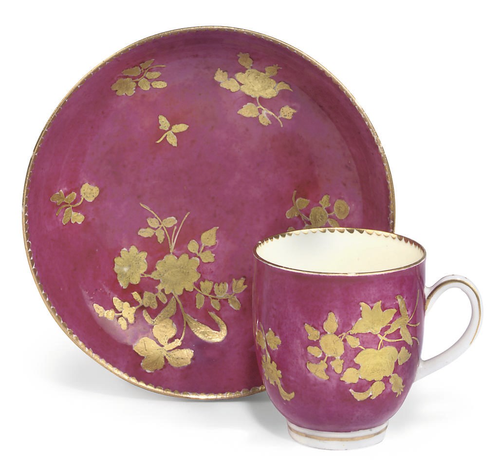 A WORCESTER LATER-DECORATED MOTTLED-PINK-GROUND COFFEE-CUP AND SAUCER