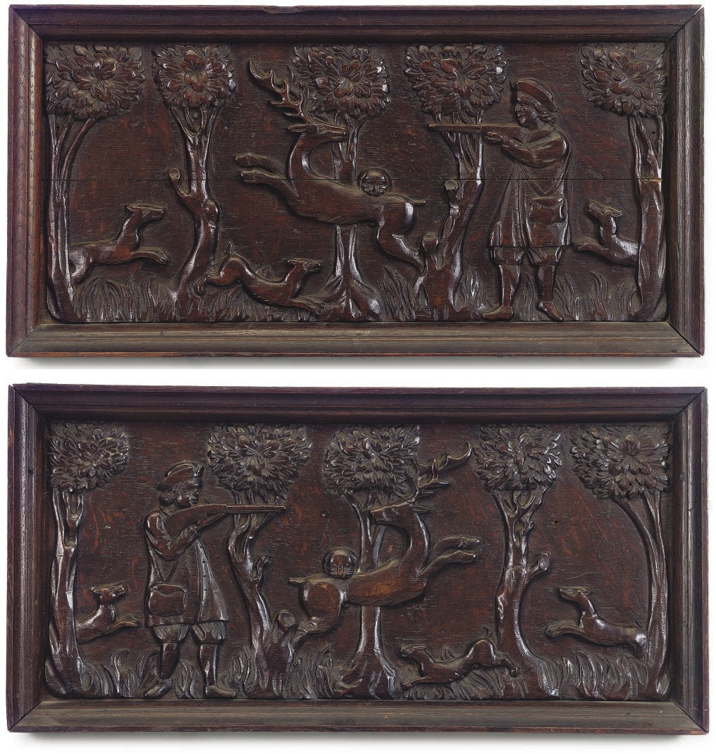 A PAIR OF FLEMISH CARVED OAK PANELS DEPICTING A STAG HUNT