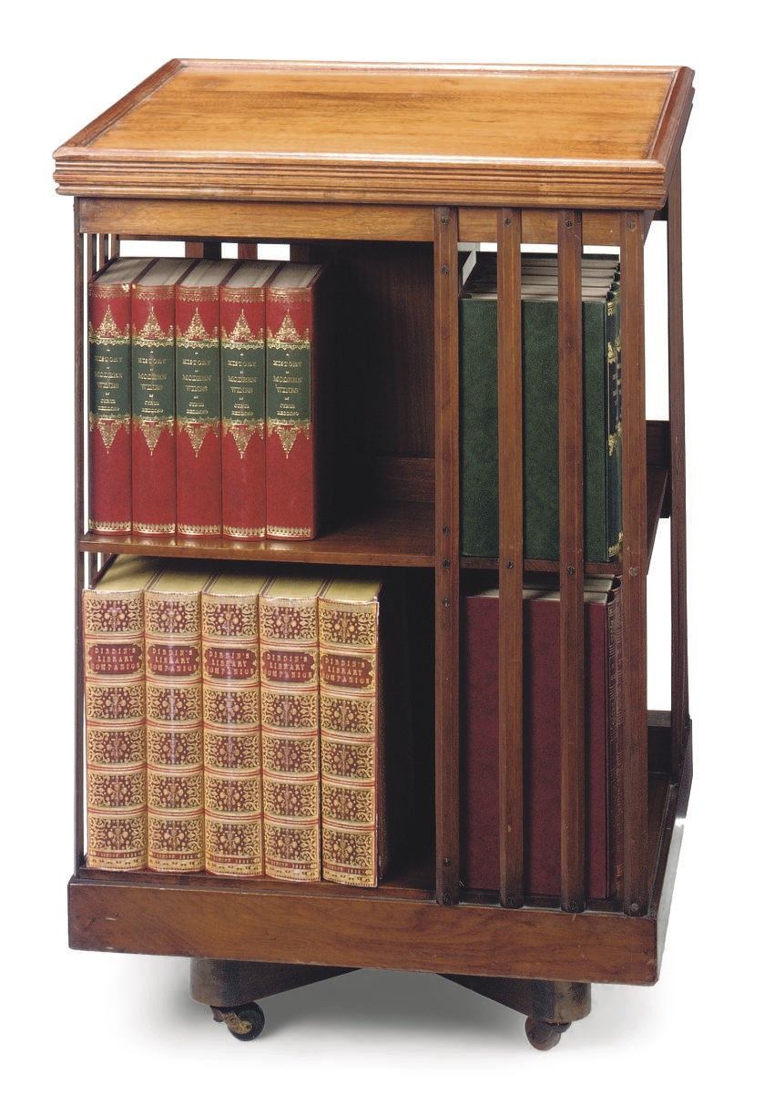 A VICTORIAN WALNUT REVOLVING BOOKCASE