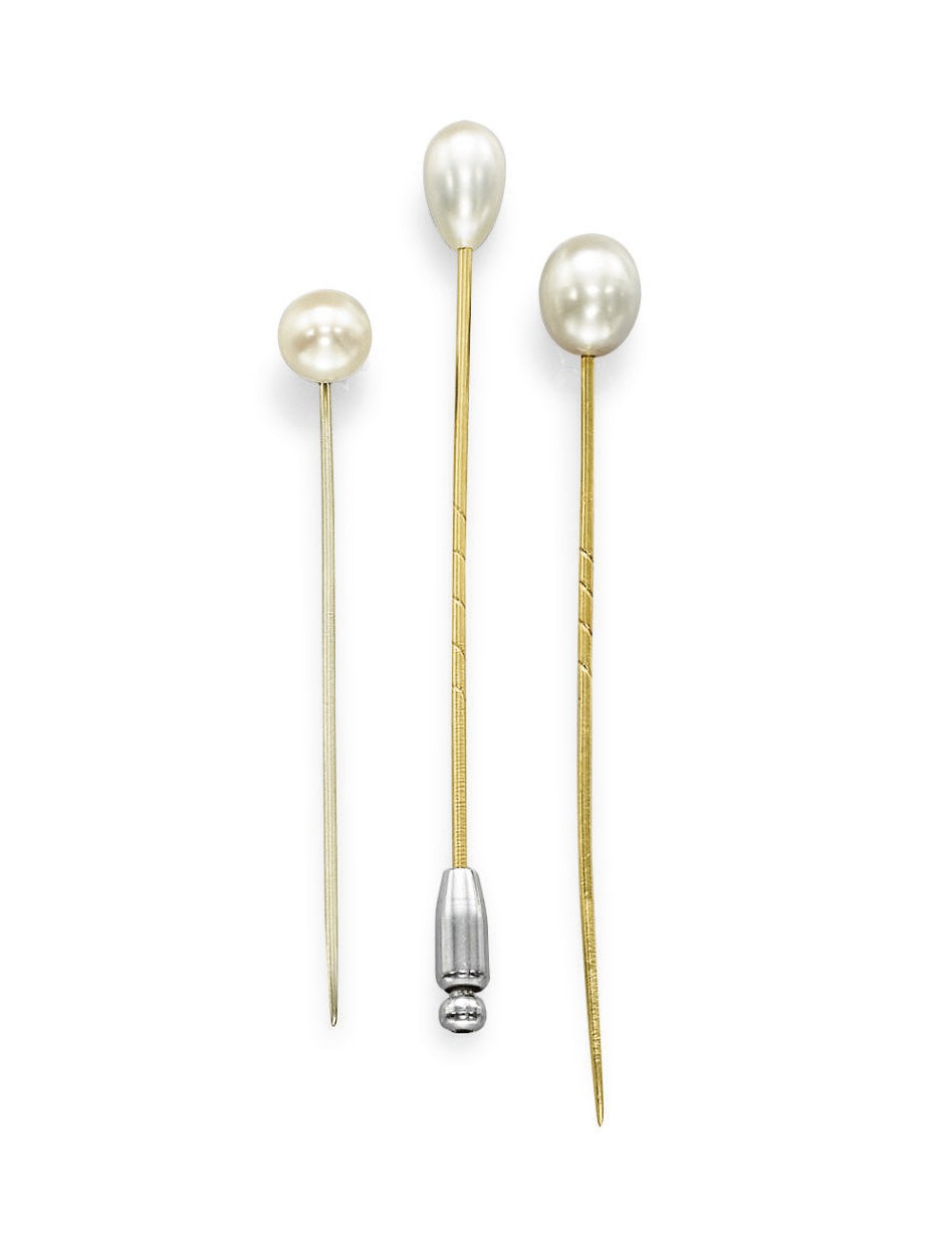 A GROUP OF THREE NATURAL PEARL TIE PINS
