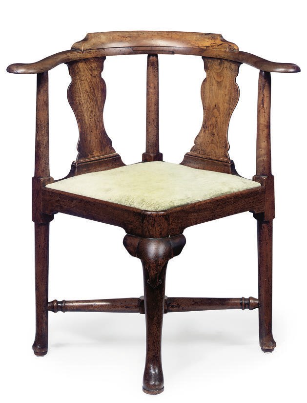 A GEORGE II WALNUT CORNER CHAIR