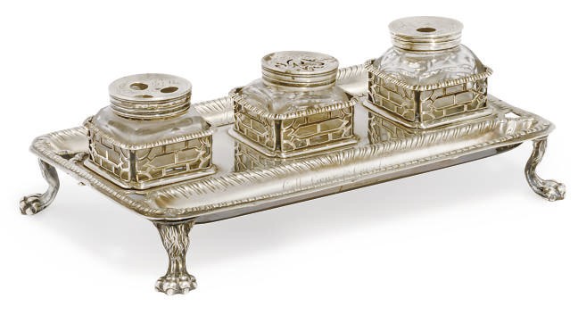 A GEORGE III SILVER THREE BOTTLE INKSTAND