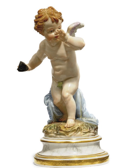 A MEISSEN FIGURE OF CUPID