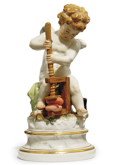 A MEISSEN FIGURE OF CUPID