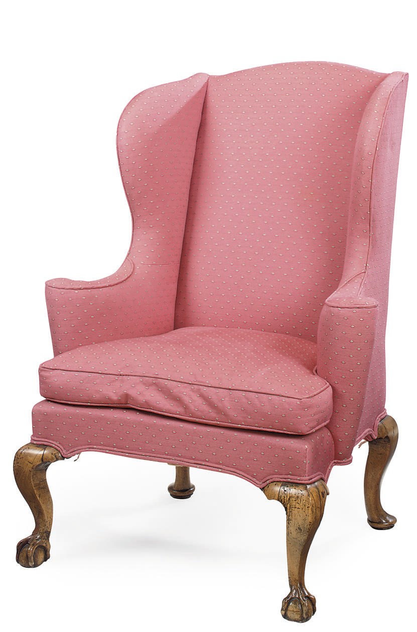 A GEORGE II WALNUT WING ARMCHAIR