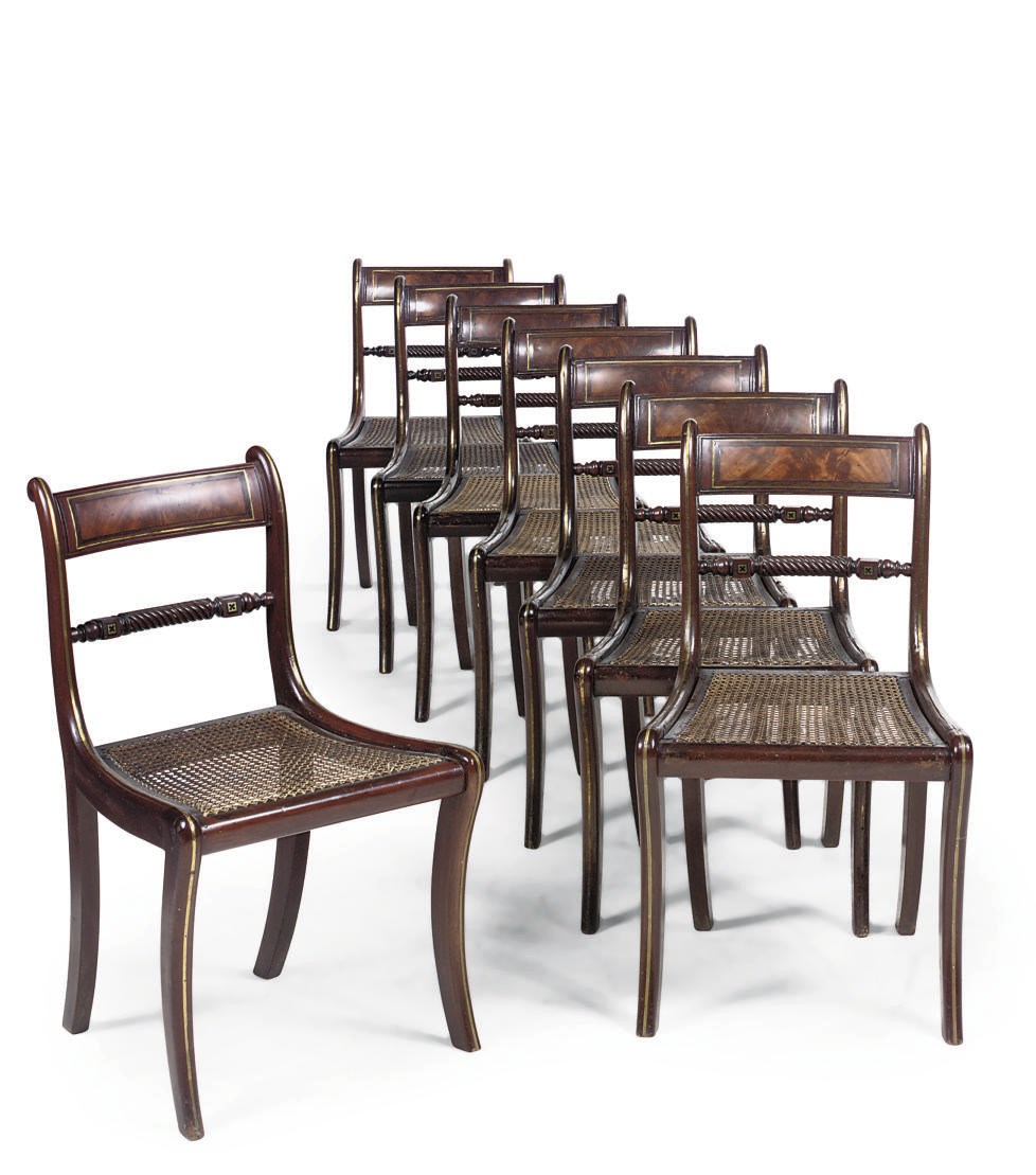 A SET OF EIGHT REGENCY MAHOGANY BRASS INLAID AND ROSEWOOD CROSSBANDED DINING CHAIRS
