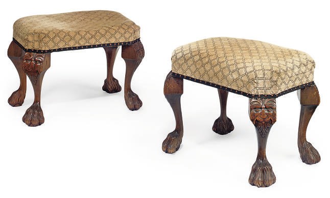 A PAIR OF CARVED WALNUT STOOLS