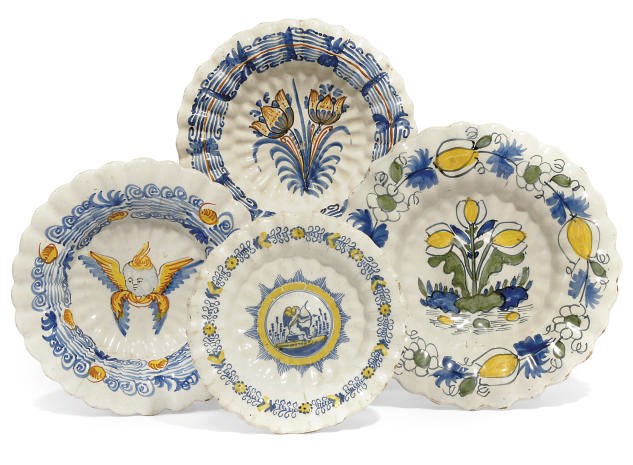 FOUR DUTCH DELFT POLYCHROME FLUTED CIRCULAR DISHES