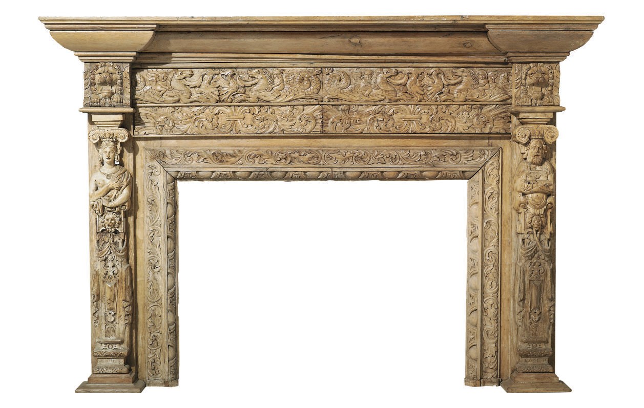 A VICTORIAN CARVED OAK CHIMNEYPIECE