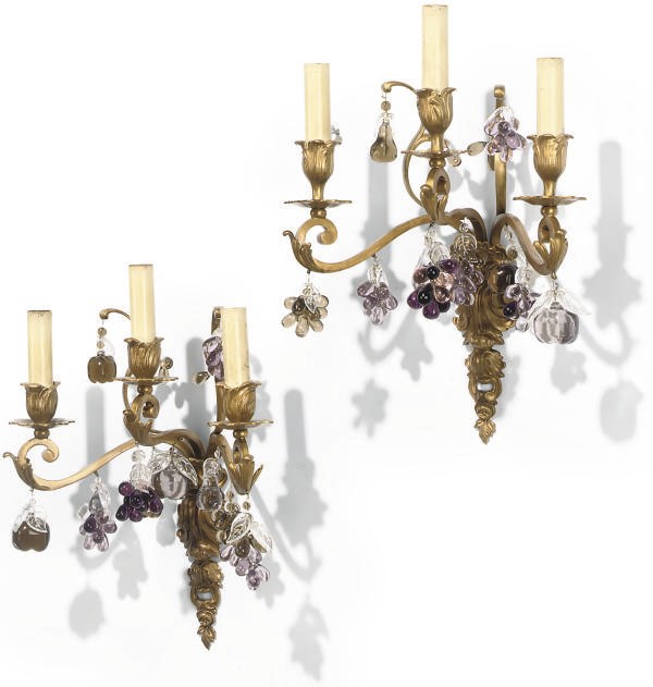 A SET OF FOUR GILT-METAL AND AMYTHEST TINTED GLASS THREE-LIGHT WALL APPLIQUES
