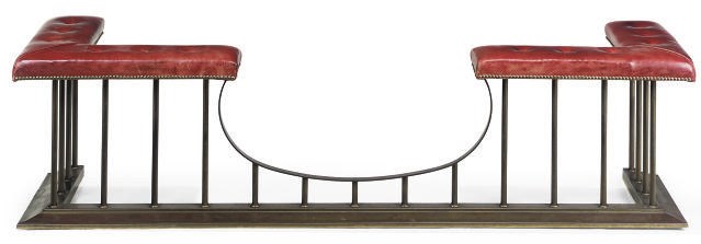A BRASS AND LEATHER UPHOLSTERED CLUB FENDER