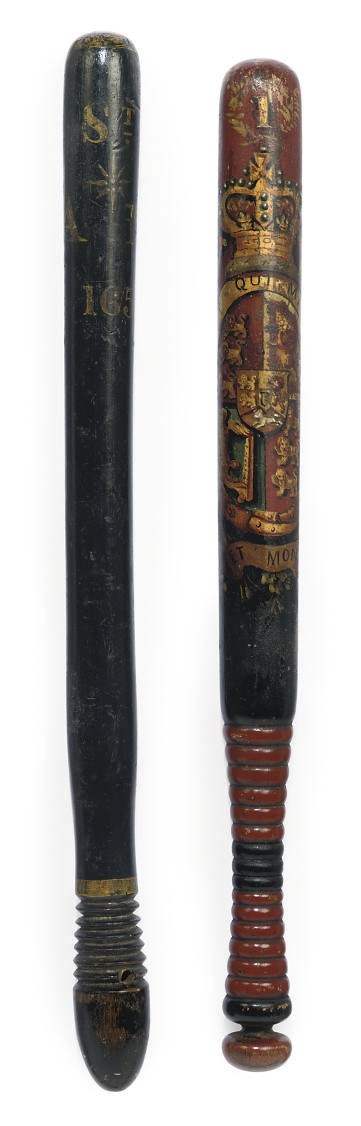 AN EBONISED WOOD TRUNCHEON