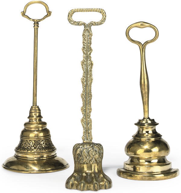 THREE LATE VICTORIAN BRASS DOOR STOPS