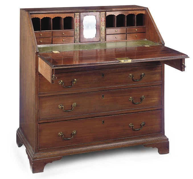 A LATE GEORGE III MAHOGANY CROSSBANDED BUREAU