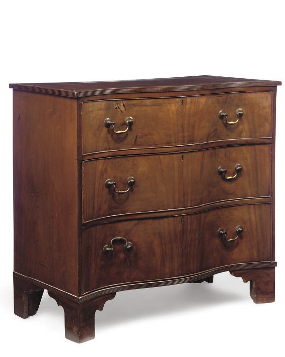 A LATE GEORGE III MAHOGANY SERPENTINE CHEST