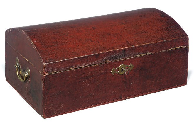 AN ENGLISH RED LEATHER DOMED TOP CHEST