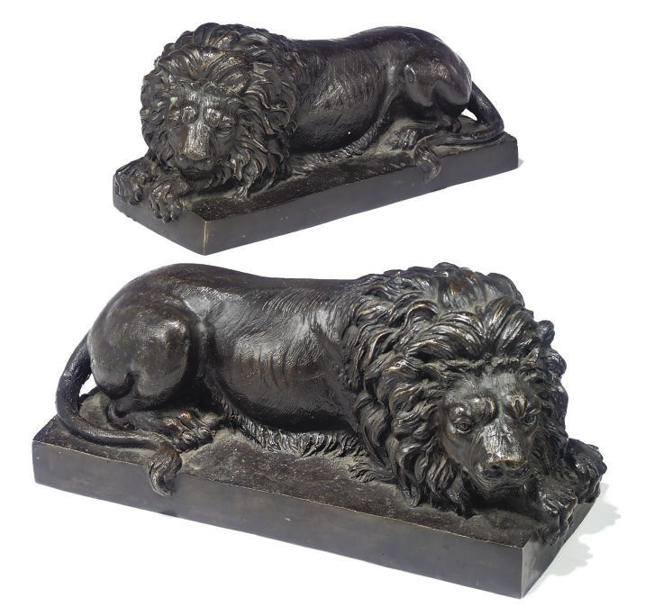 A PAIR OF ITALIAN BRONZE MODELS OF RECUMBENT LIONS