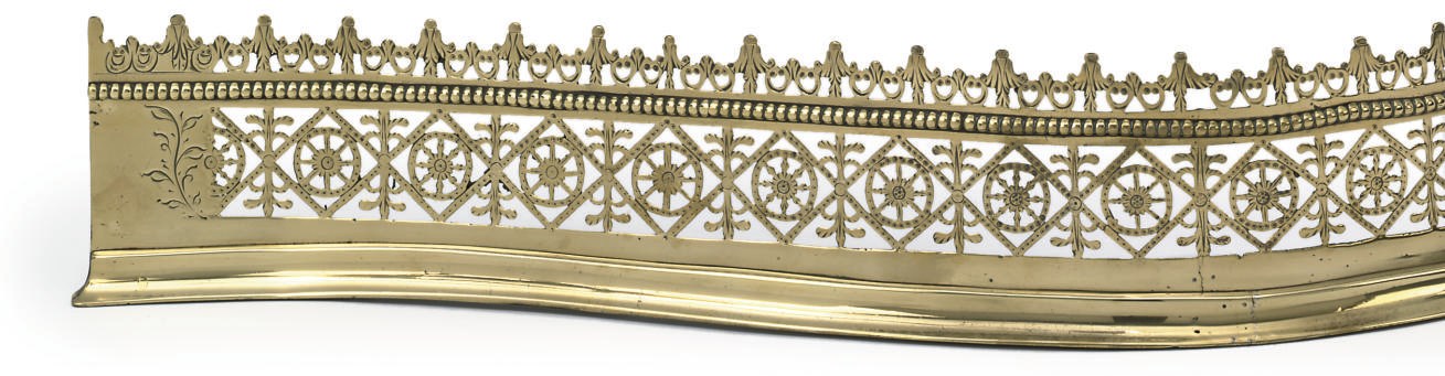 A GEORGE III BRASS SERPENTINE FENDER