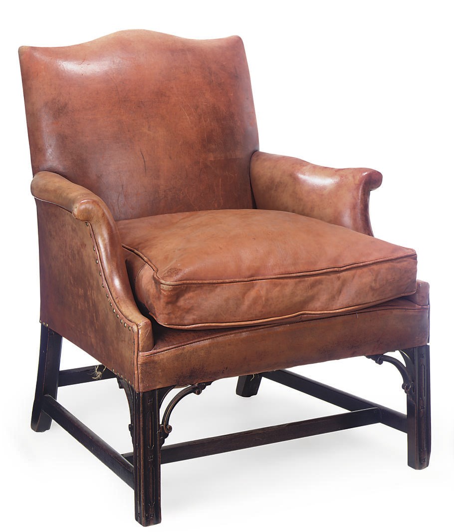 A MAHOGANY AND LEATHER UPHOLSTERED ARMCHAIR