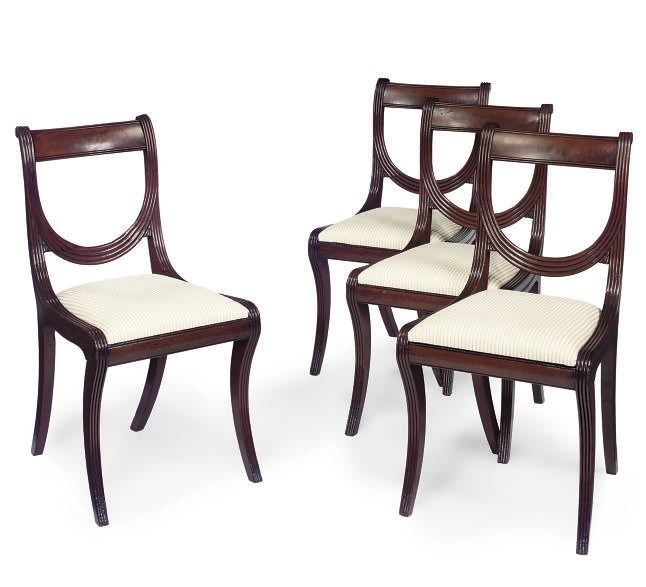A SET OF FOUR REGENCY MAHOGANY DINING CHAIRS