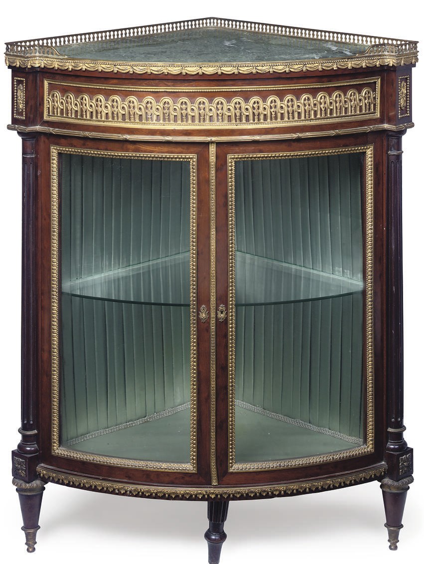 A FRENCH GILT-BRONZE MOUNTED MAHOGANY ENCOIGNURE
