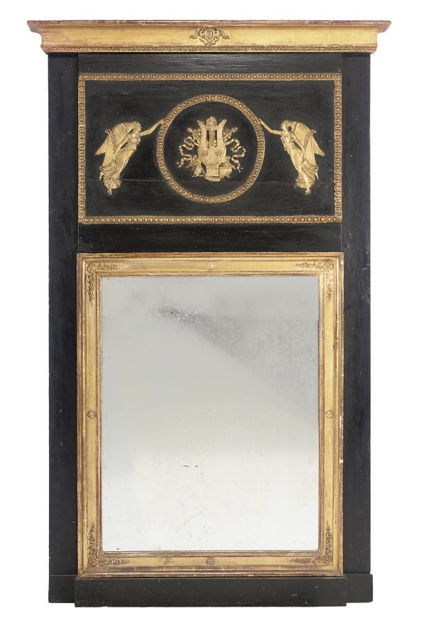 A NORTH EUROPEAN EBONISED AND PARCEL GILT TRUMEAU MIRROR